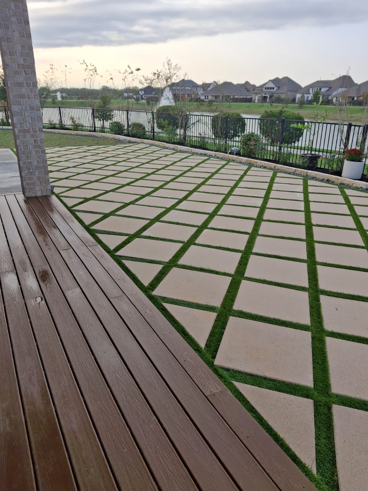 IMG-20250303-WA0122 concrete tiles and deck in backyard