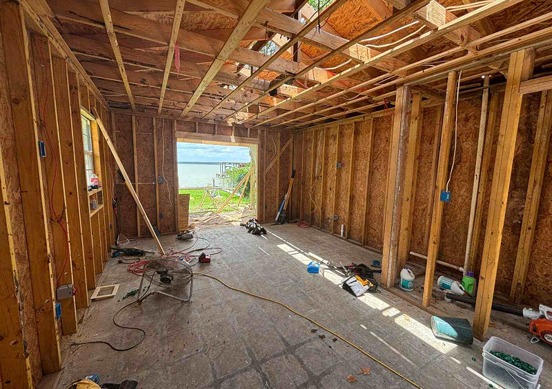 House under construction with lake view