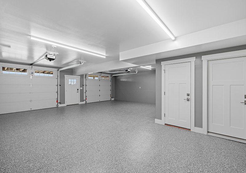 Empty garage with overhead lighting