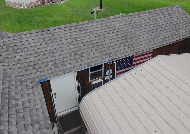 House with American flag and gray roof