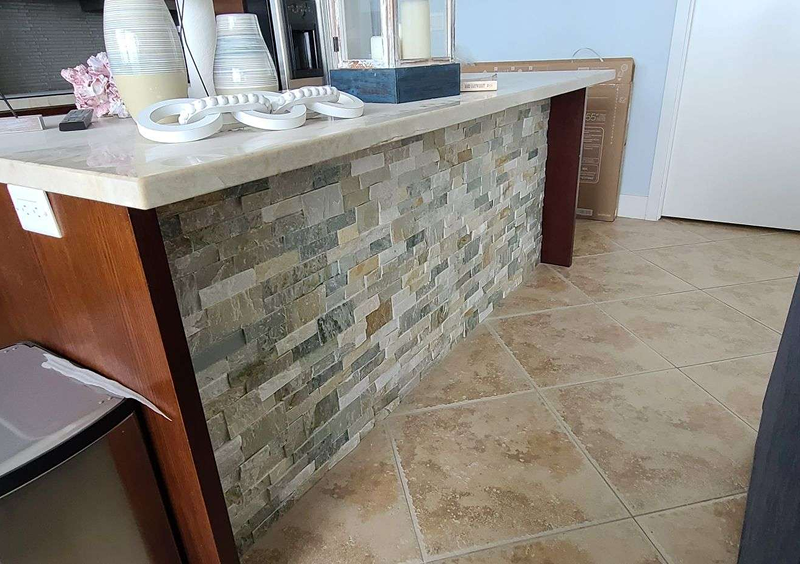 Modern kitchen island with stone accents
