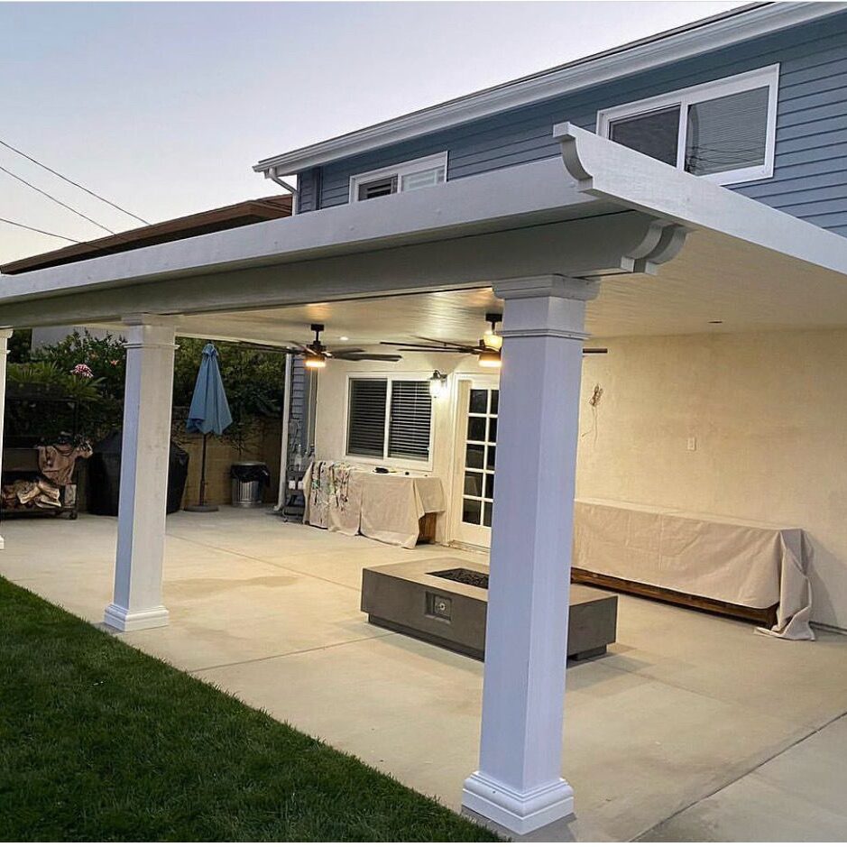 Backyard patio with white pergola