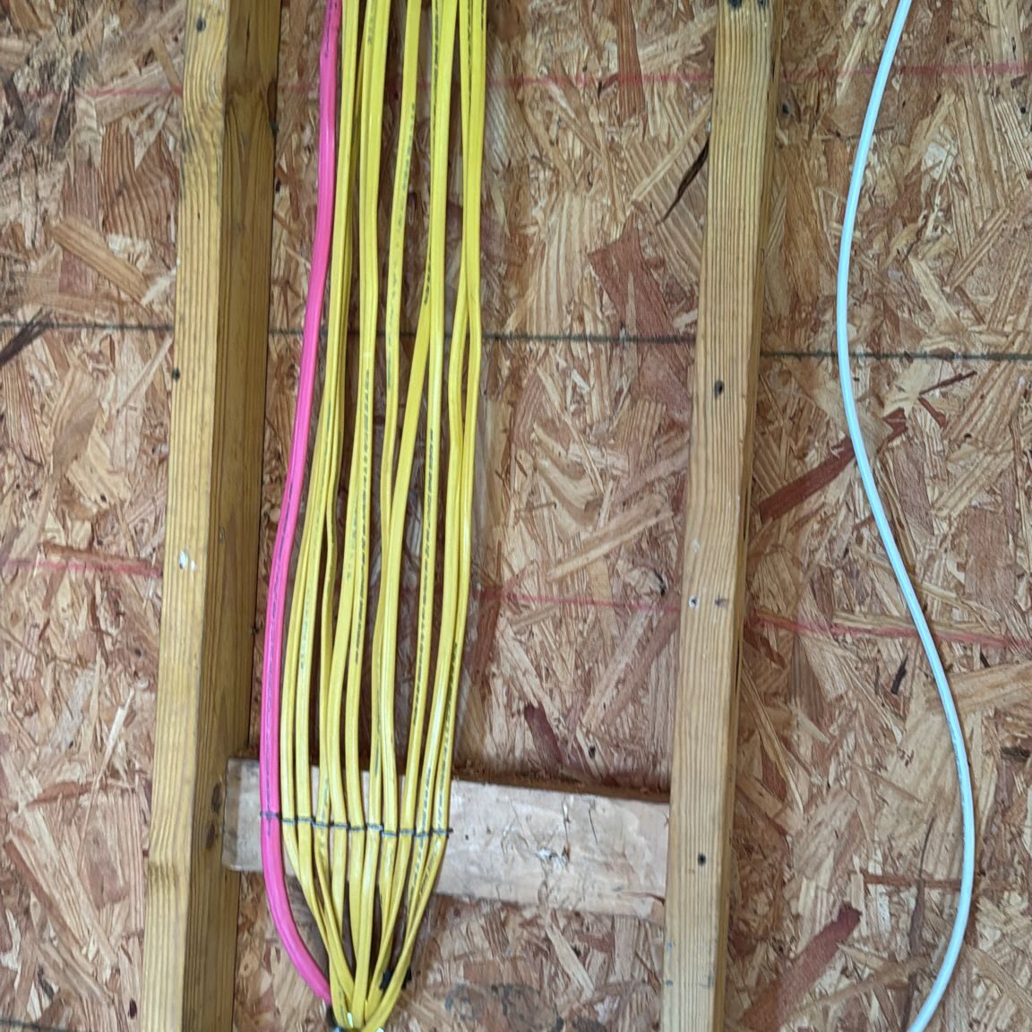 Electrical wires organized in wooden frame