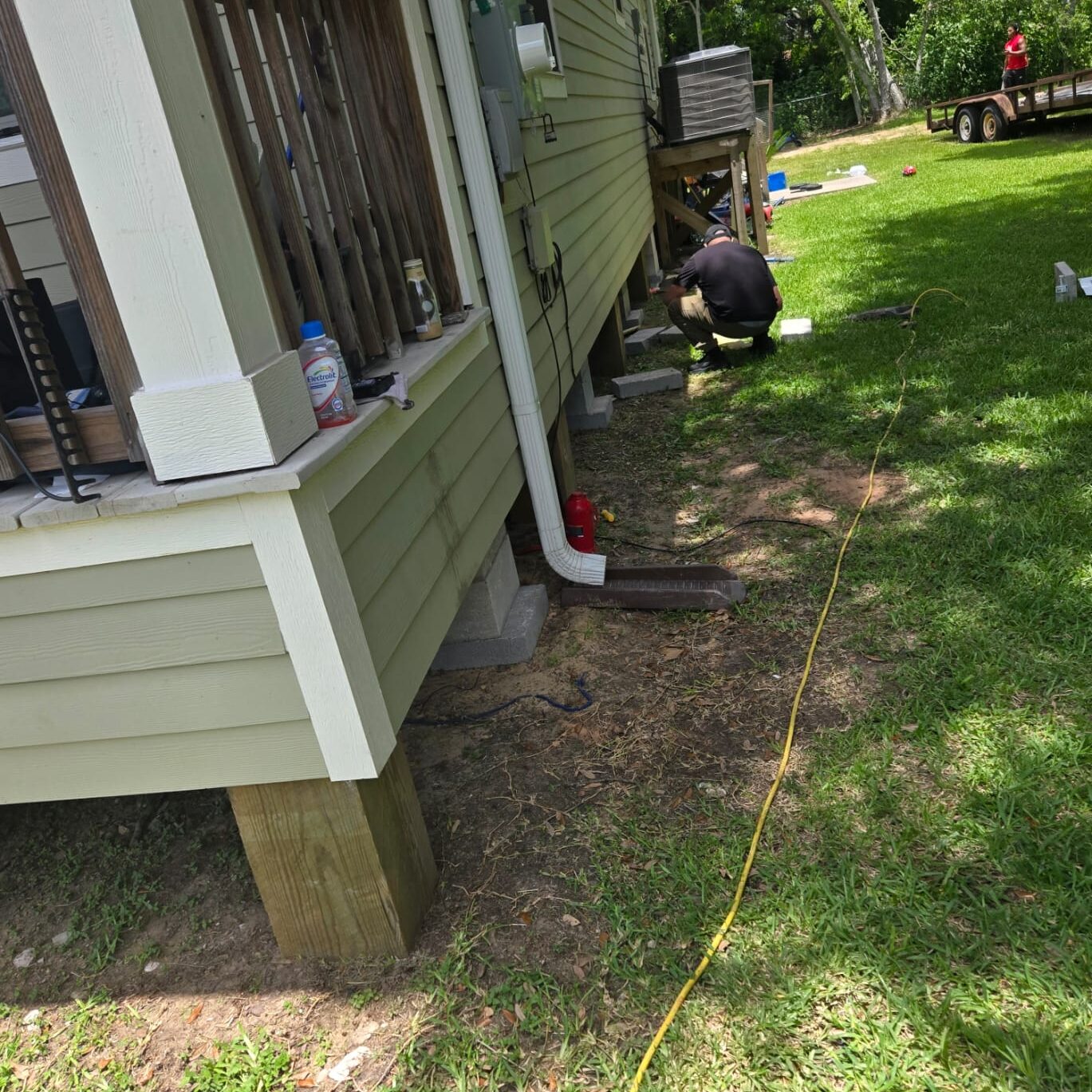 Home maintenance in grassy yard