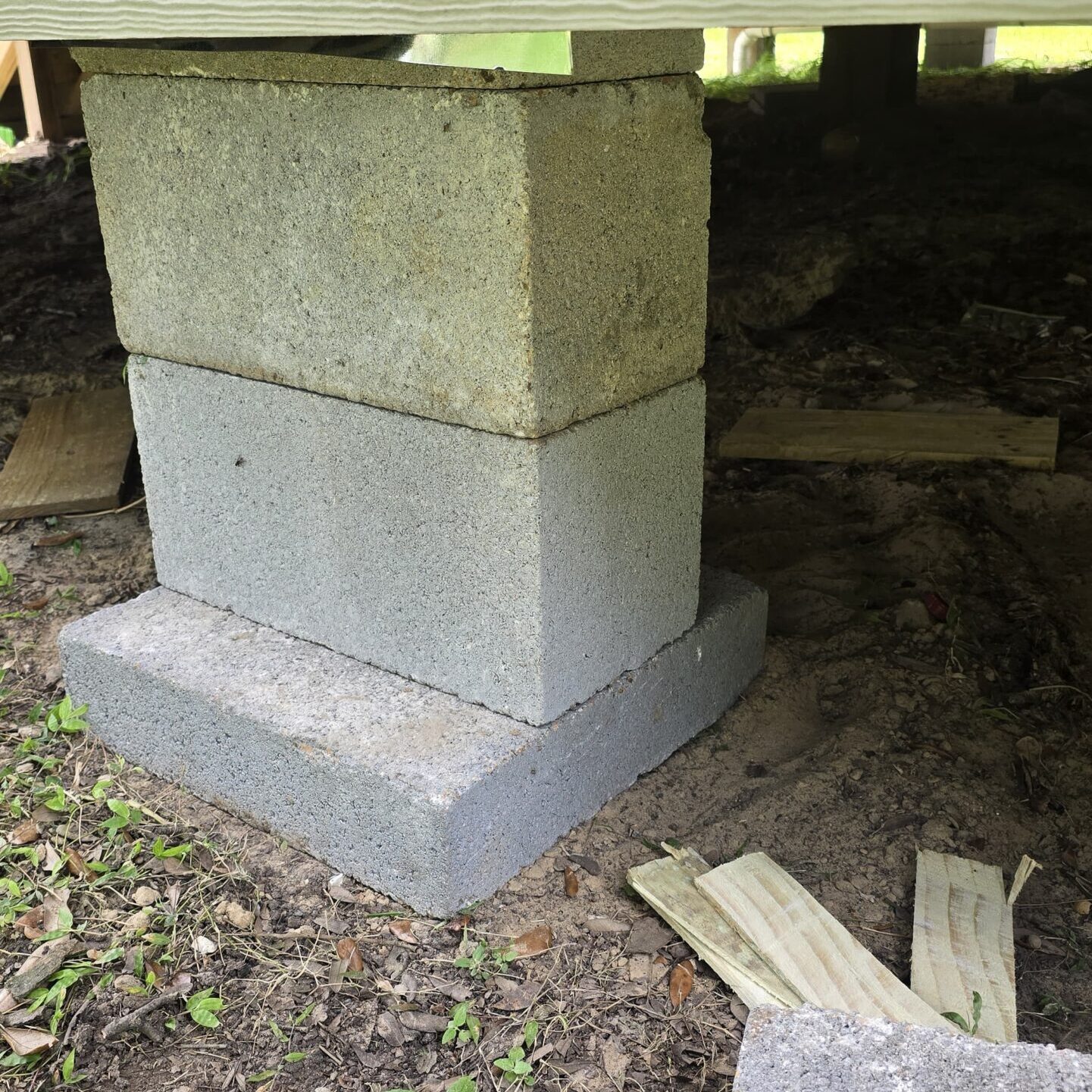 Stacked blocks under a building structure