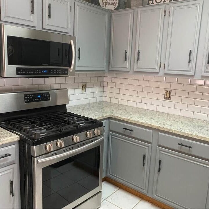 Granite countertop and tiled backsplash